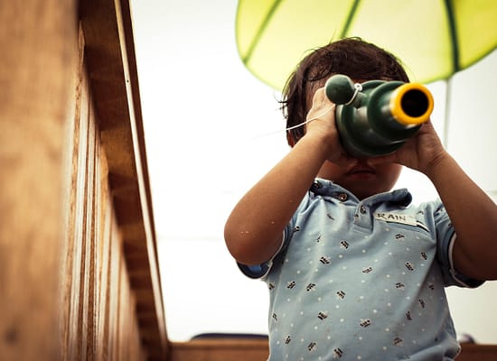 Little boy with binoculars